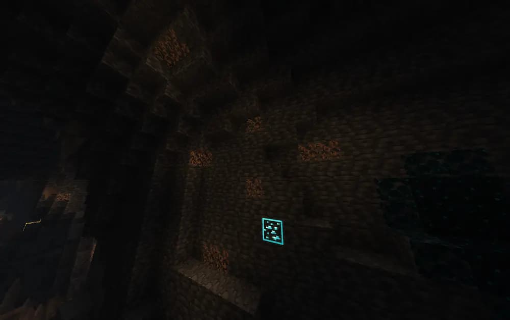Glow lichen on a wall in a dark cave with diamonds